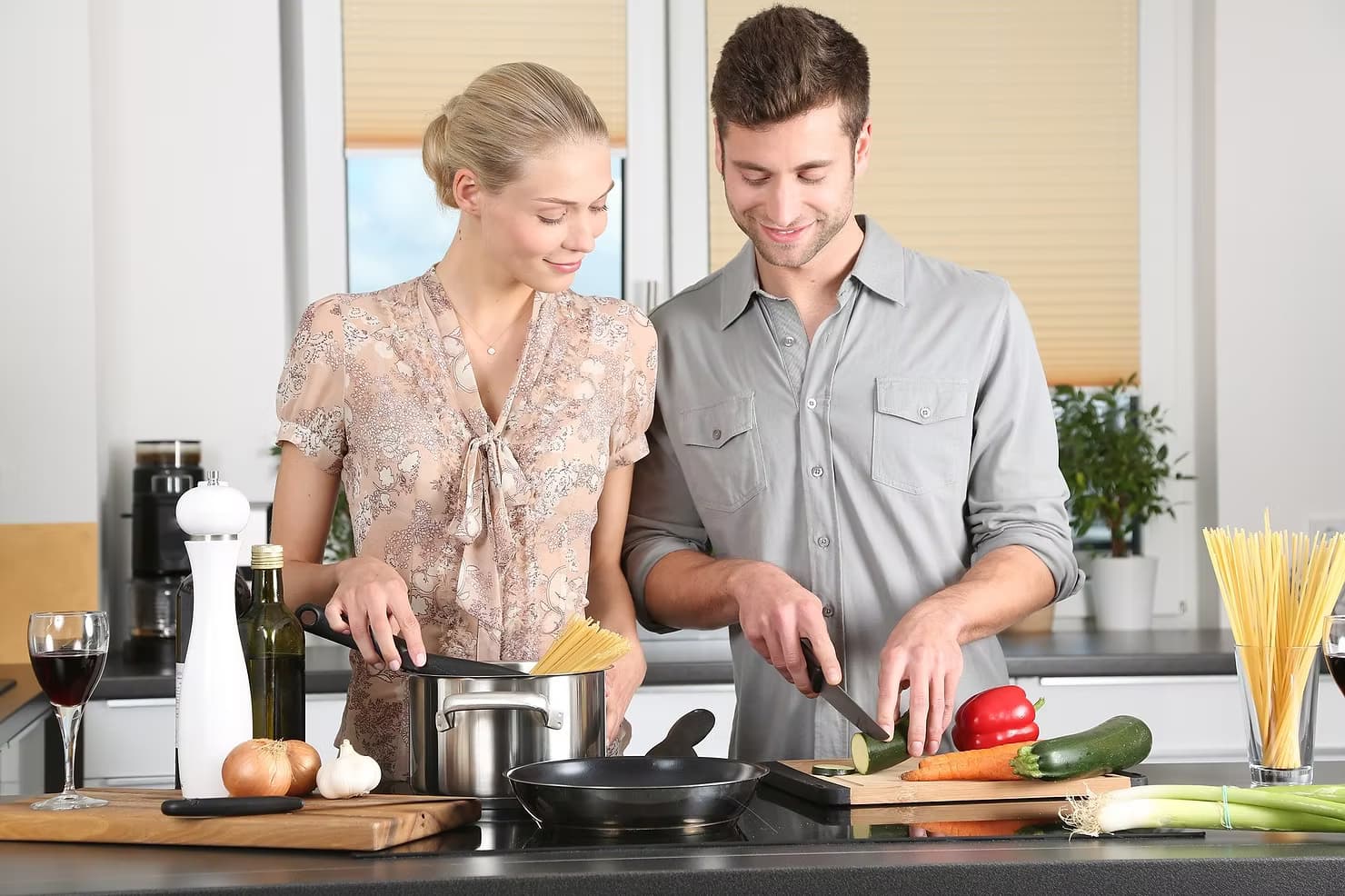 two people cooking